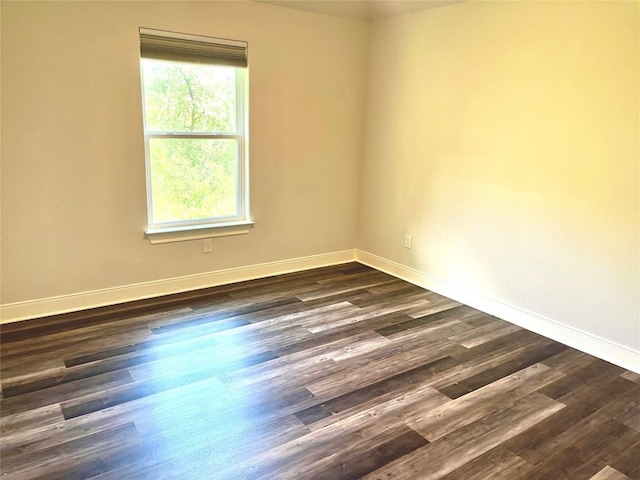 108 W Keamuku Ct, Bastrop, TX 78602 - spare room with baseboards and dark wood-style flooring
