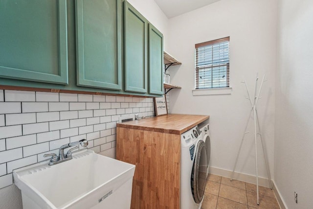 2520 Bluebonnet Ln Unit 48, Austin, TX 78704 - laundry area with washer and dryer, cabinet space, and light tile patterned flooring