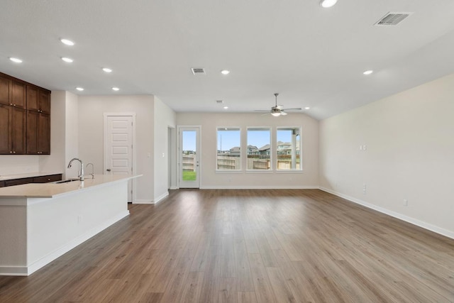 1754 Sawmill Xing, Round Rock, TX 78665 - unfurnished living room featuring recessed lighting, light wood-style flooring, and a ceiling fan