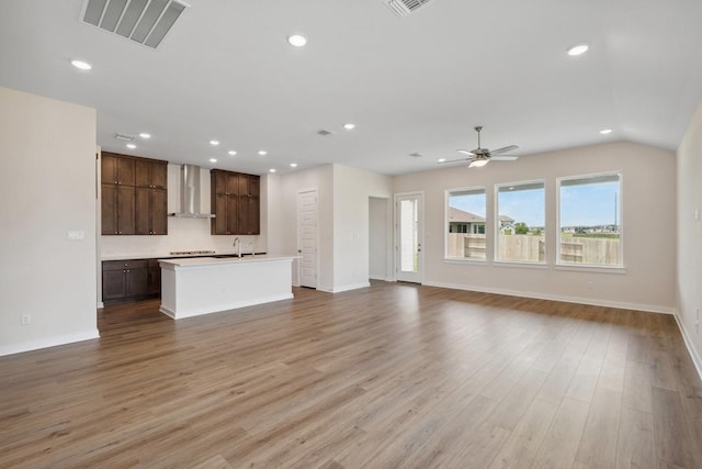 1754 Sawmill Xing, Round Rock, TX 78665 - unfurnished living room with recessed lighting, light wood-type flooring, and ceiling fan