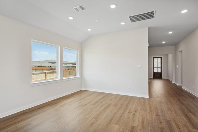 1754 Sawmill Xing, Round Rock, TX 78665 - spare room featuring plenty of natural light, wood finished floors, and recessed lighting
