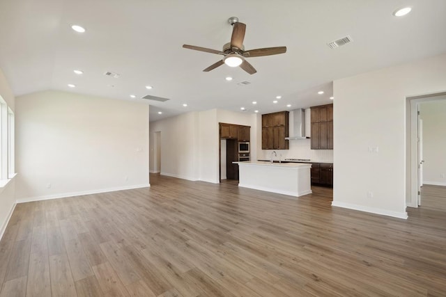 1754 Sawmill Xing, Round Rock, TX 78665 - unfurnished living room featuring ceiling fan, light wood-style flooring, recessed lighting, and lofted ceiling