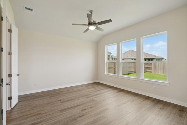 1754 Sawmill Xing, Round Rock, TX 78665 - empty room featuring wood finished floors, ceiling fan, and lofted ceiling