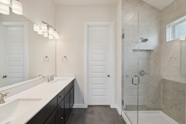 1754 Sawmill Xing, Round Rock, TX 78665 - bathroom with a stall shower, double vanity, and tile patterned flooring