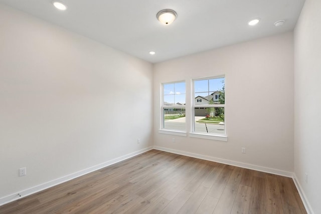 1754 Sawmill Xing, Round Rock, TX 78665 - empty room with wood finished floors, recessed lighting, and a smoke detector