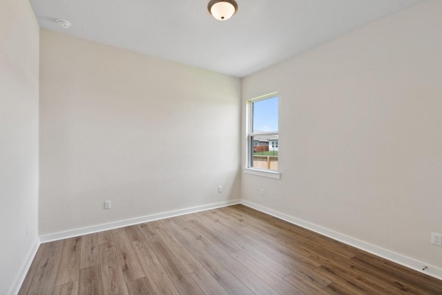 1754 Sawmill Xing, Round Rock, TX 78665 - empty room featuring wood finished floors and a smoke detector