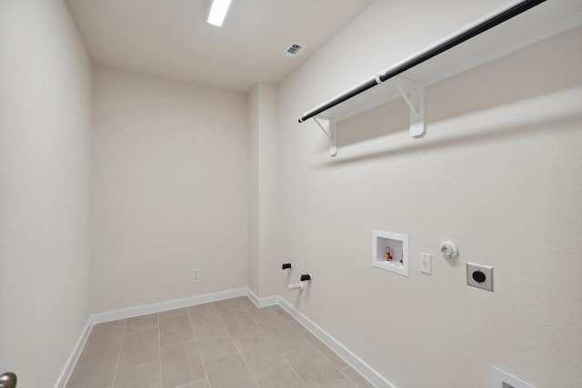 1754 Sawmill Xing, Round Rock, TX 78665 - laundry room with hookup for a gas dryer, hookup for an electric dryer, washer hookup, and light tile patterned floors