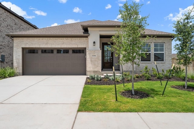 1754 Sawmill Xing, Round Rock, TX 78665 - view of front of home with brick siding, an attached garage, a front lawn, concrete driveway, and a shingled roof