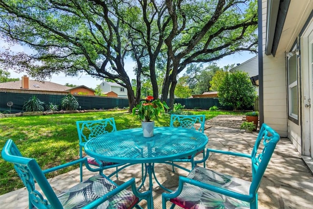1305 Doonesbury Dr, Austin, TX 78758 - fenced backyard featuring a patio and outdoor dining space