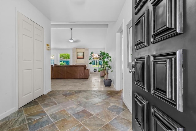 1305 Doonesbury Dr, Austin, TX 78758 - foyer with stone tile flooring and baseboards