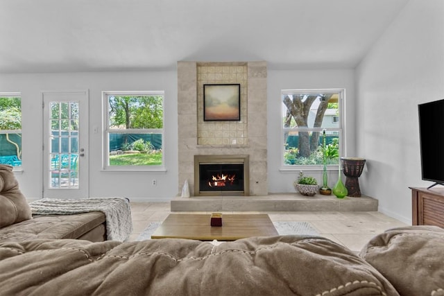 1305 Doonesbury Dr, Austin, TX 78758 - tiled living room with a large fireplace and baseboards