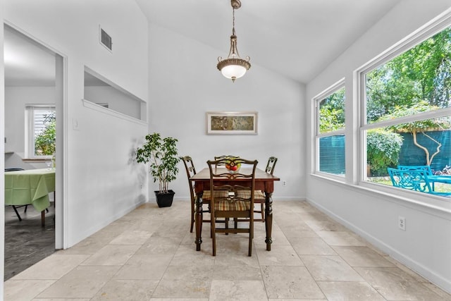 1305 Doonesbury Dr, Austin, TX 78758 - dining space with lofted ceiling and baseboards