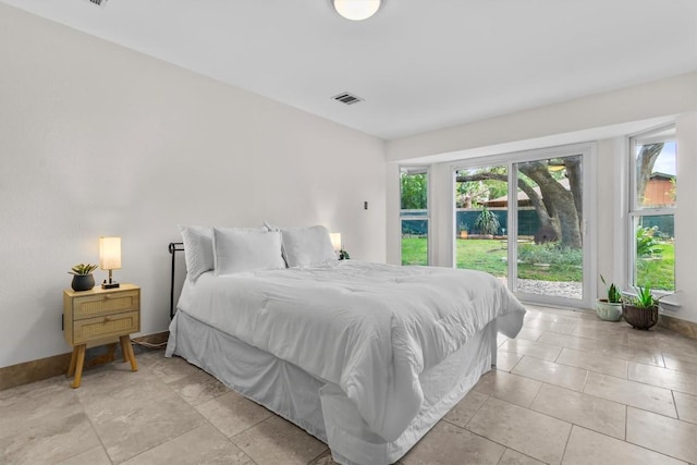 1305 Doonesbury Dr, Austin, TX 78758 - bedroom featuring access to exterior and light tile patterned floors