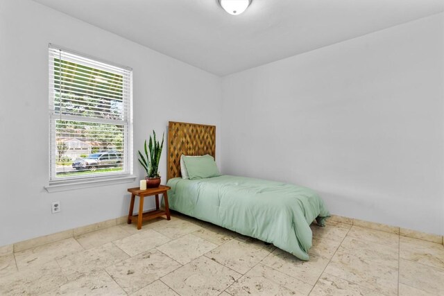 1305 Doonesbury Dr, Austin, TX 78758 - bedroom featuring baseboards