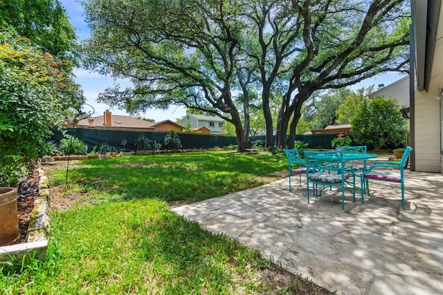 1305 Doonesbury Dr, Austin, TX 78758 - fenced backyard with a patio and outdoor dining area