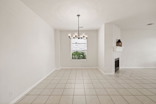 2732 Cascade Falls Dr, Austin, TX 78738 - unfurnished room with a chandelier, light tile patterned flooring, and a fireplace