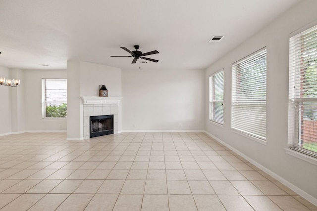 2732 Cascade Falls Dr, Austin, TX 78738 - unfurnished living room with healthy amount of natural light, a tile fireplace, and a ceiling fan