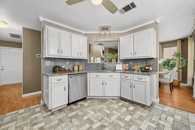 8305 Hillrock Dr, Round Rock, TX 78681 - kitchen with stainless steel dishwasher, white cabinetry, decorative backsplash, and a ceiling fan
