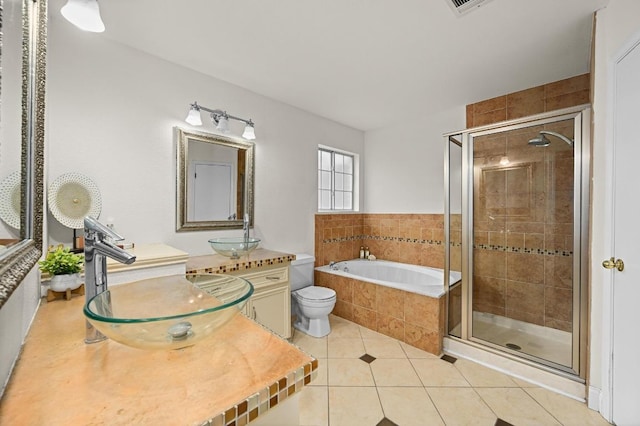 8305 Hillrock Dr, Round Rock, TX 78681 - full bath with a shower stall, tile patterned flooring, a garden tub, and vanity