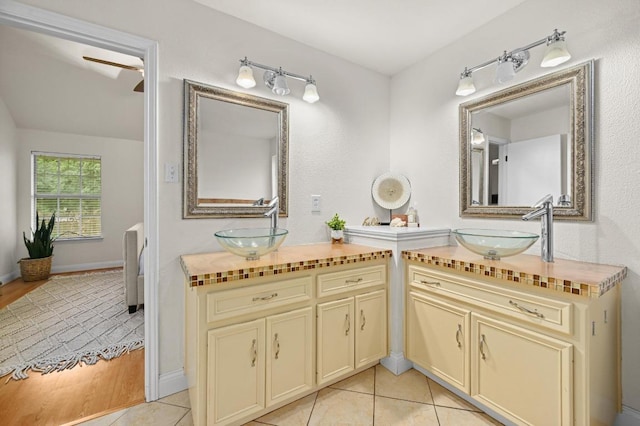 8305 Hillrock Dr, Round Rock, TX 78681 - bathroom with two vanities and tile patterned floors