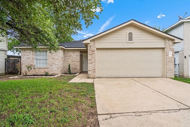 2012 Charlotte Way, Round Rock, TX 78664 - view of front of house featuring brick siding, concrete driveway, an attached garage, and a front yard