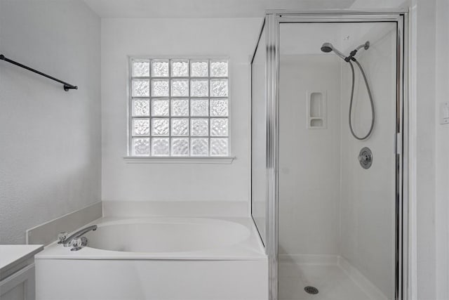2012 Charlotte Way, Round Rock, TX 78664 - bathroom featuring a bath, a stall shower, and vanity