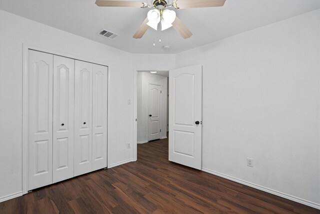 2012 Charlotte Way, Round Rock, TX 78664 - unfurnished bedroom featuring dark wood-style flooring, a closet, and a ceiling fan