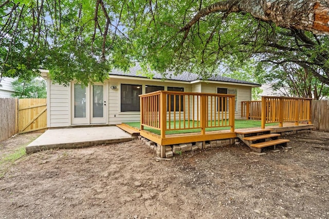 2012 Charlotte Way, Round Rock, TX 78664 - back of property featuring a wooden deck, a fenced backyard, and a patio area