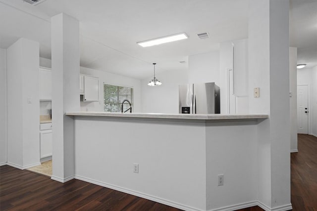 2012 Charlotte Way, Round Rock, TX 78664 - kitchen featuring stainless steel fridge with ice dispenser, white cabinets, dark wood finished floors, and a chandelier