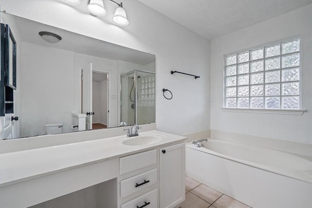 2012 Charlotte Way, Round Rock, TX 78664 - bathroom with a garden tub, vanity, a shower stall, and tile patterned floors