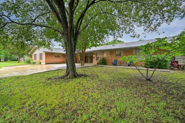 2110 Bluebonnet Ln, Austin, TX 78704 - view of front of home with driveway, brick siding, and a front yard