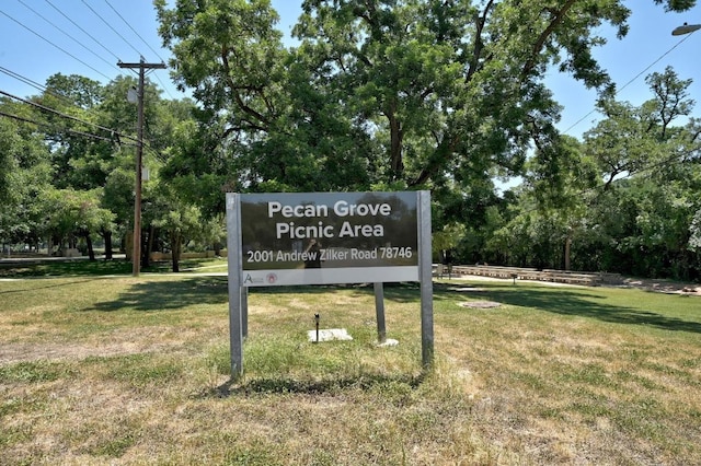 2110 Bluebonnet Ln, Austin, TX 78704 - community sign featuring a yard and view of wooded area