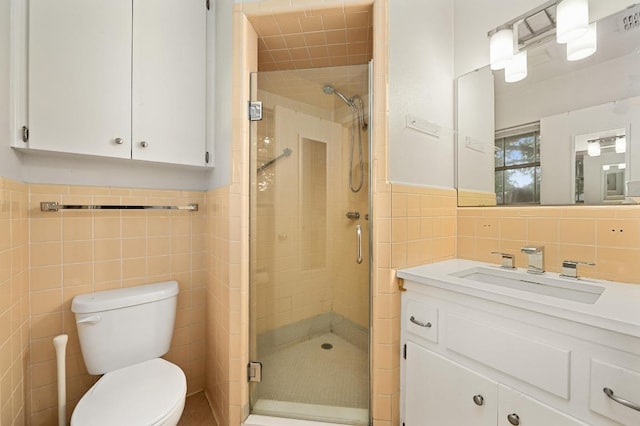 2110 Bluebonnet Ln, Austin, TX 78704 - full bathroom with tile walls, vanity, a shower stall, and a wainscoted wall
