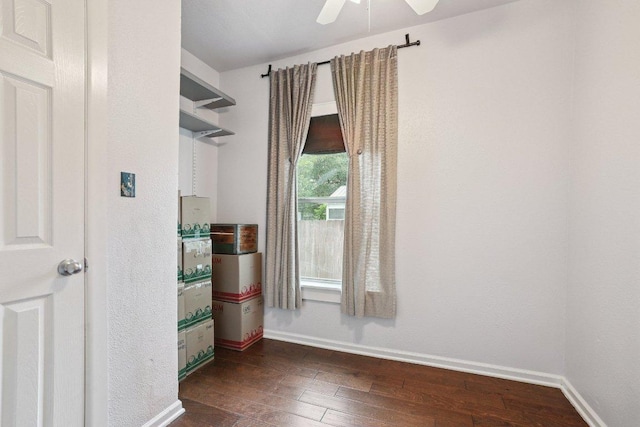 1916 Pecan St, Bastrop, TX 78602 - empty room with dark wood-type flooring and ceiling fan