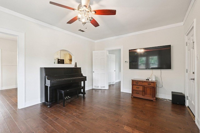 1916 Pecan St, Bastrop, TX 78602 - living area featuring a ceiling fan, dark wood-style flooring, and ornamental molding