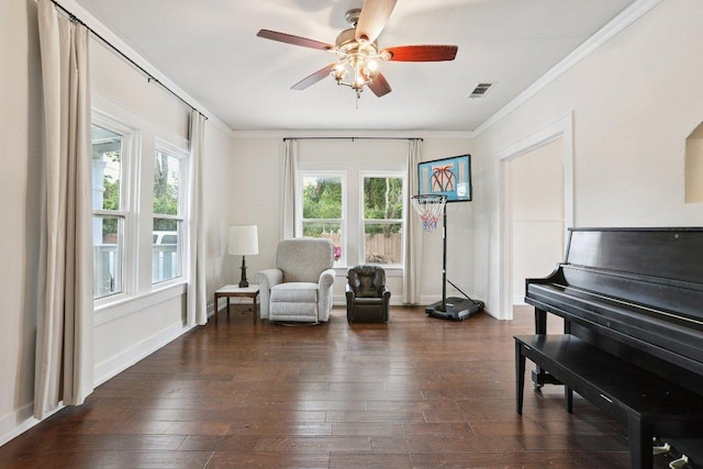 1916 Pecan St, Bastrop, TX 78602 - sitting room with ornamental molding, dark wood-type flooring, and a ceiling fan