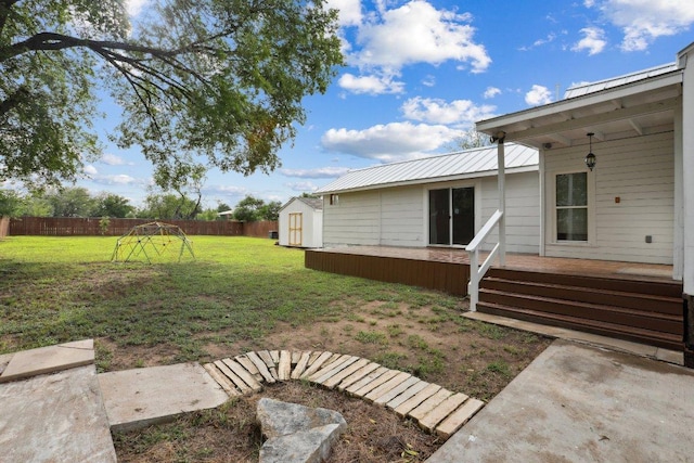 1916 Pecan St, Bastrop, TX 78602 - fenced backyard featuring a storage unit and a wooden deck