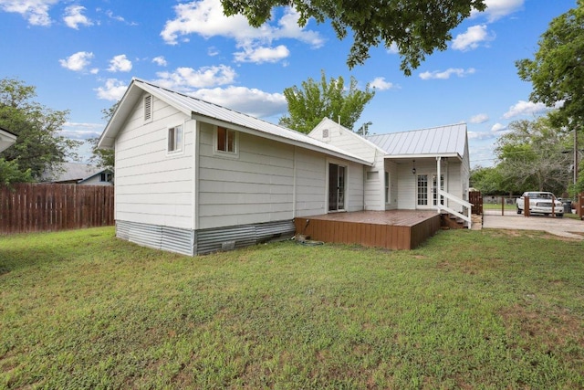 1916 Pecan St, Bastrop, TX 78602 - rear view of property with a metal roof, french doors, and a deck