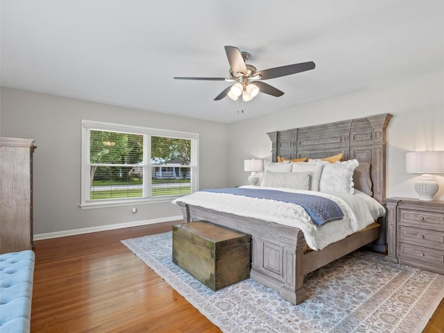 bedroom with wood finished floors and ceiling fan