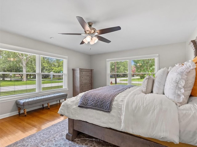 bedroom with wood finished floors and a ceiling fan