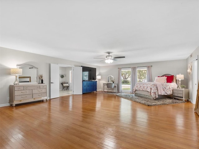 bedroom with wood finished floors and a ceiling fan