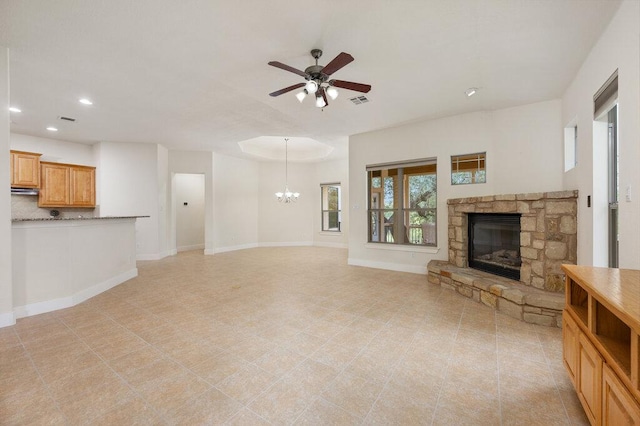 105 Outcrop View Ln, Austin, TX 78738 - unfurnished living room featuring a fireplace, ceiling fan, recessed lighting, and a chandelier