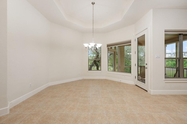 105 Outcrop View Ln, Austin, TX 78738 - empty room with healthy amount of natural light, a chandelier, and a raised ceiling