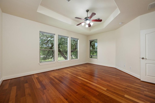 105 Outcrop View Ln, Austin, TX 78738 - empty room featuring a tray ceiling, wood-type flooring, ceiling fan, and a smoke detector