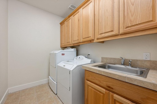 105 Outcrop View Ln, Austin, TX 78738 - laundry area featuring washing machine and dryer and cabinet space