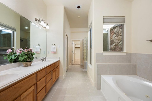 105 Outcrop View Ln, Austin, TX 78738 - bathroom featuring a whirlpool tub, double vanity, and tile patterned floors