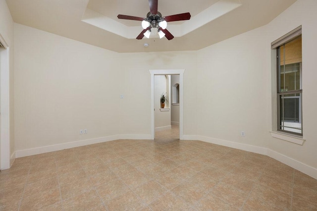 105 Outcrop View Ln, Austin, TX 78738 - unfurnished room with a tray ceiling and ceiling fan