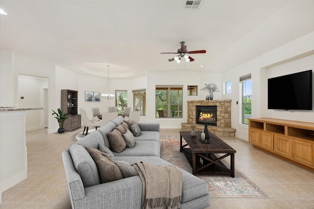 105 Outcrop View Ln, Austin, TX 78738 - living room featuring a ceiling fan, light tile patterned flooring, and a fireplace