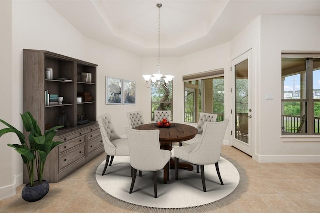 105 Outcrop View Ln, Austin, TX 78738 - dining space with a chandelier, light tile patterned floors, and a raised ceiling