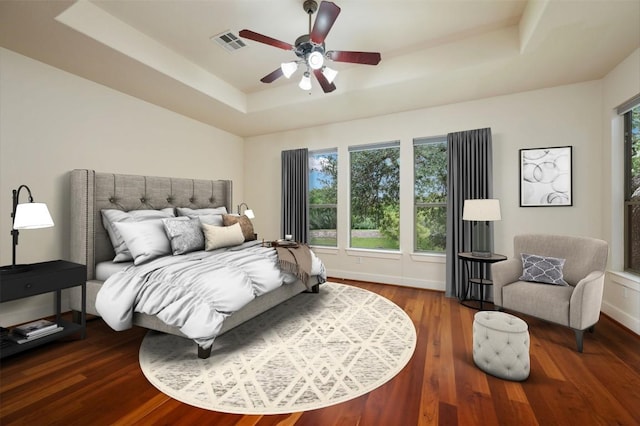 105 Outcrop View Ln, Austin, TX 78738 - bedroom with a tray ceiling, wood finished floors, and a ceiling fan